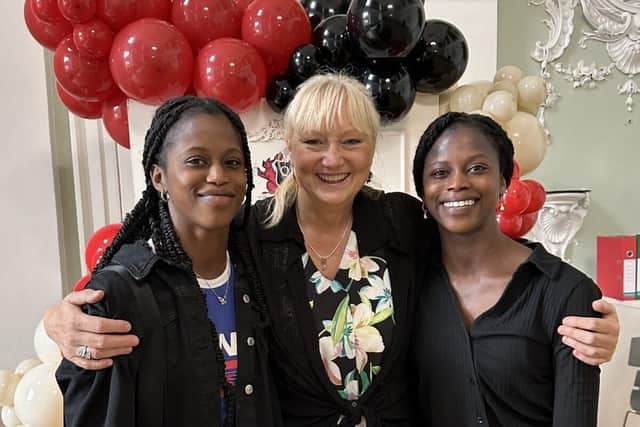 Rebekah and Rachael F celebrate their success with Mrs White, Head of Art and Photography
