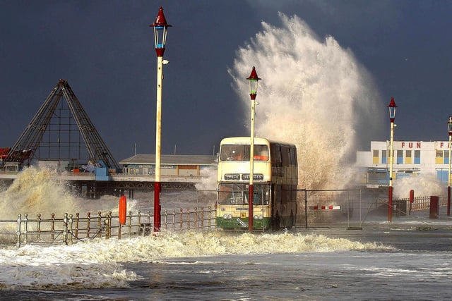 A bus on Blackpool Promenade is engulfed by a wave as gale force winds and high seas batter the resort on Thursday December 7, 2006