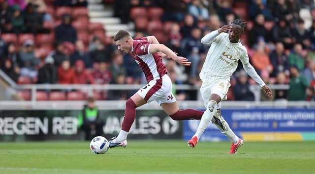 Jake Evans drives forward