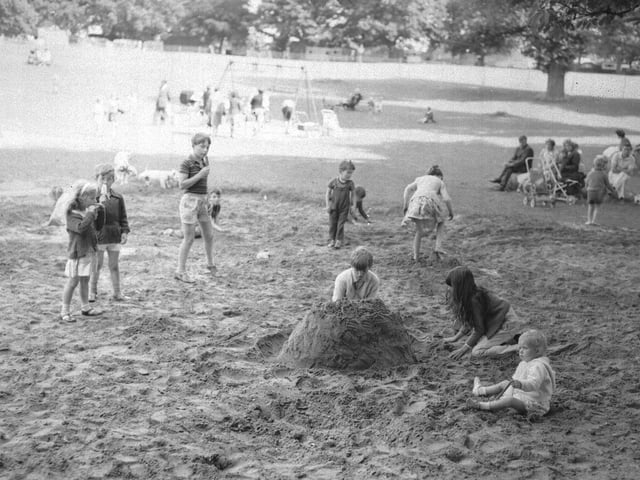 July 25, 1966 - children playing in sandpit in park