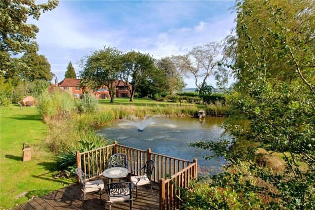 This spacious home comes with extensive gardens and great views.