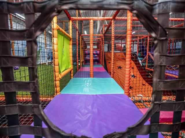 There is a new sensory room, car wash role play zone, two large ball pits with ball showers, and a sports court with astroturf on the top level.