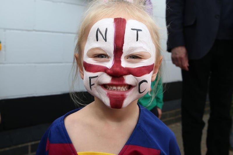 A young Northampton Town fan with a painted face looks on prior to the Sky Bet League Two match between Northampton Town and Newport County at PTS Academy Stadium on September 14, 2019.