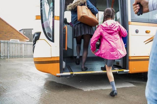 Child getting on a bus