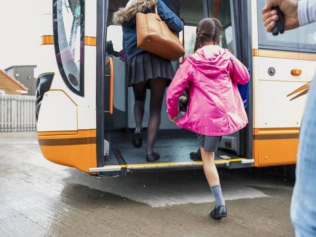 Child getting on a bus
