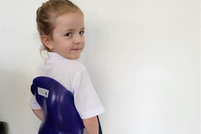 Isla in one of Harry's old spinal braces that she will wear to school on Children in Need day.