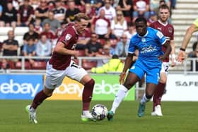 Mitch Pinnock moves away from Kwame Poku during the Sky Bet League One match between Northampton Town and Peterborough United at Sixfields. (Photo by Pete Norton/Getty Images)