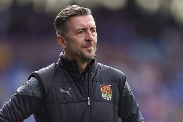 Jon Brady watches on during Northampton's League One game against Shrewsbury.