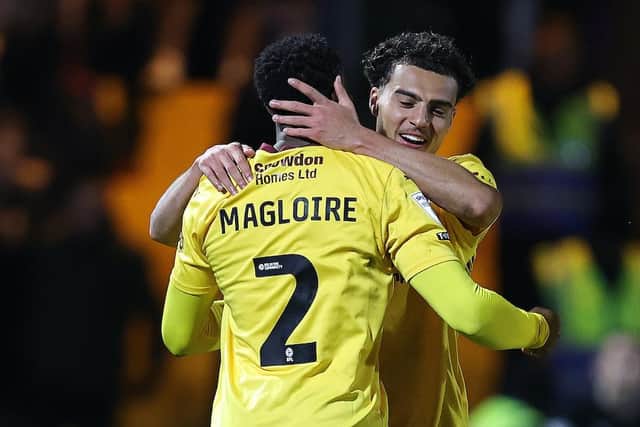 Nesta Guinness-Walker embaraces goalscorer Tyler Magloire