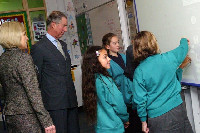 Prince Charles watches a lesson with children at Upton Meadows school