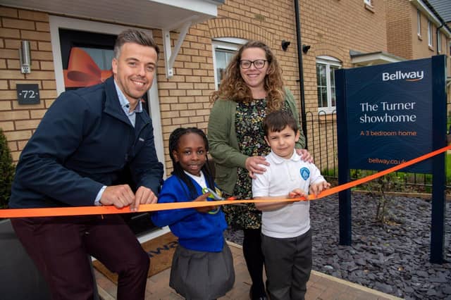 Stanton Cross Primary School Head of School Sarah Whitlock and pupils unveiling the Turner showhome