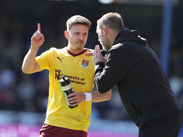 Kevin Nolan passes on some instructions to Sam Hoskins