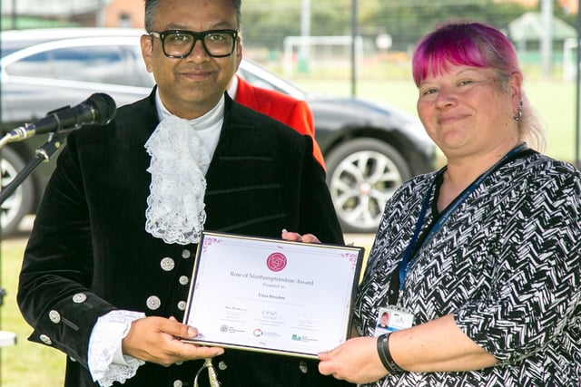Northamptonshire High Sheriff, Milan Shah MBE, presenting Trina Breedom from Family Support Link with a Rose of Northamptonshire Award. Family Support Link aims to reduce the physical, psychological and emotional harm caused to families and individuals living with or caring for someone who is addicted to drugs and/or alcohol, supporting people across Northamptonshire.
