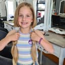 Penny Newton, aged 8, after having over 14 inches of her hair cut for The Little Princess Trust.