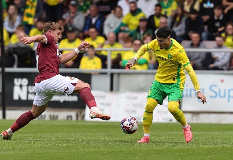 Sam Hoskins challenges for the ball with Borja Sainz