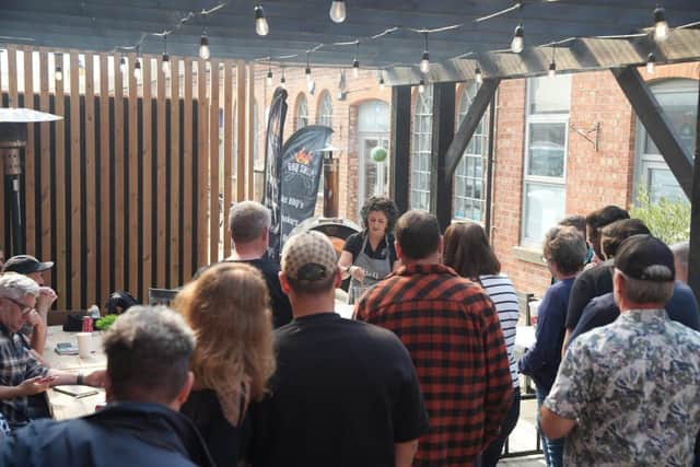 Tammy Pell of Bell of Northampton showcasing her pizza cooking skills at the BBQ masterclass