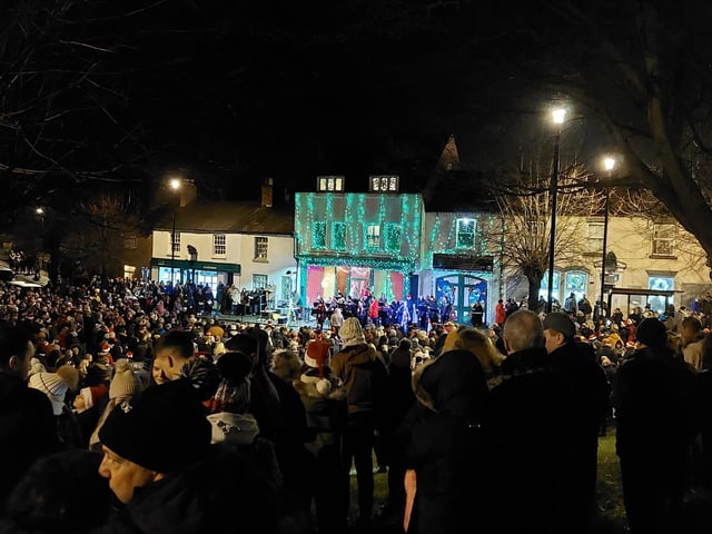 Earls Barton celebrates Christmas Eve in the Square - People gathered on the mound by the church