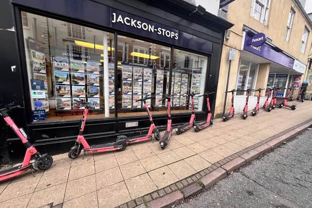 Voi e-scooters abandoned outside Jackson Stops Estate Agents in Northampton town centre