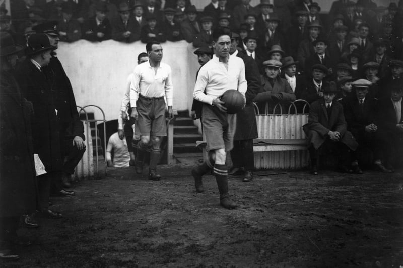 Jimmy Seed leads the Tottenham Hotspur team on to the pitch at White Hart Lane for their first round FA Cup match against Northampton Town.