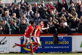 James Armson celebrates in front of the delighted Brackley Town fans after he scored from the penalty spot to seal a huge win over Gateshead at St James Park. Picture by Glenn Alcock