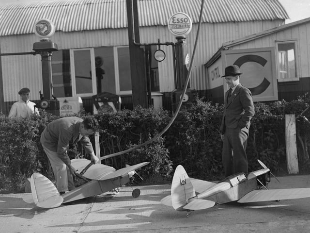 June 1935: Model aeroplanes at Sywell Aerodrome, Northampton being filled with fuel. (Photo by Fox Photos/Getty Images)