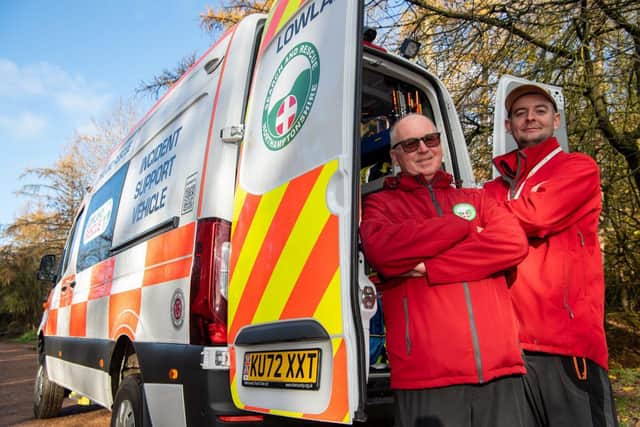 DWSM - SGB-24056 - Mebers of Northamptonshire Search and Rescue outside one of their rescue vehicles