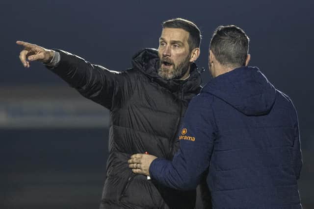 Brackley Town boss Roger Johnson makes his point to the fourth official during his side's 1-0 defeat at Boston United on Tuesday (Picture: Glenn Alcock)
