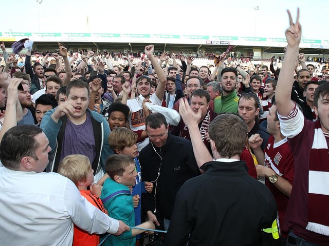 2014: Northampton Town fans celebrate at the end of the game after victory secured their league status during the Sky Bet League Two match between Northampton Town and Oxford United at Sixfields Stadium on May 3, 2014 in Northampton, England. (Photo by Pete Norton/Getty Images)