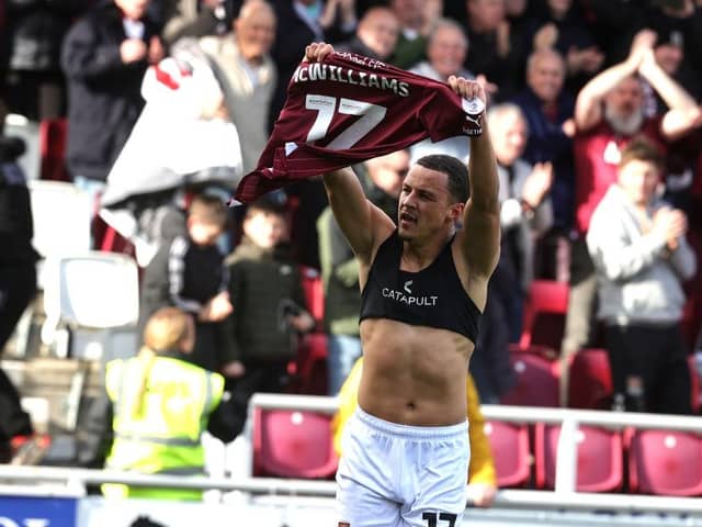 Shaun McWilliams holds his shirt aloft after scoring Town's late second against Port Vale. Pictures: Pete Norton