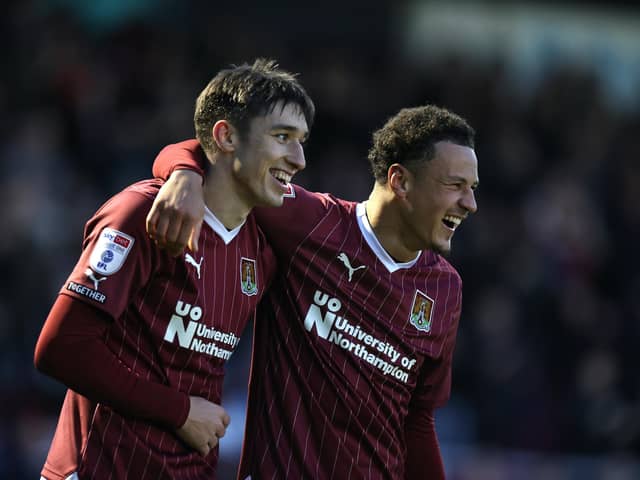 All smiles for Kieron Bowie and Shaun McWilliams after the former's goal against Cambridge.