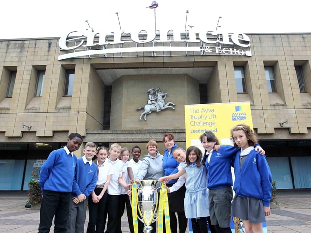 Year six children from Lings Primary School, Julie Millard, year six teacher and Anne Davies, teaching assistant and sports co-ordinator, with the Aviva Premiership trophy at the Chronicle and Echo.