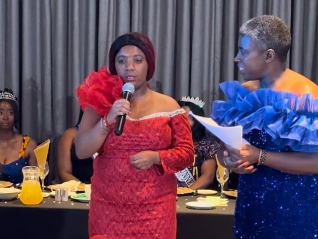 Favour, the older sister to Miss Africa GB being (Favour has additional needs) here she's being assisted by her mum to to share her speech with the audience
