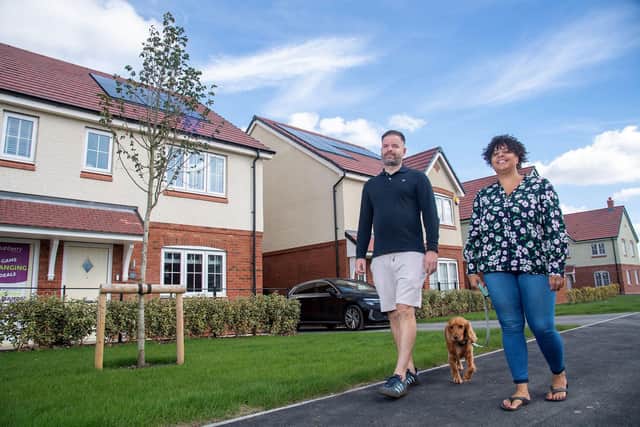 •	Kim Crichlow and Jason Hewitt outside their new house at Ashberry Homes’ The Wickets development in Desborough.