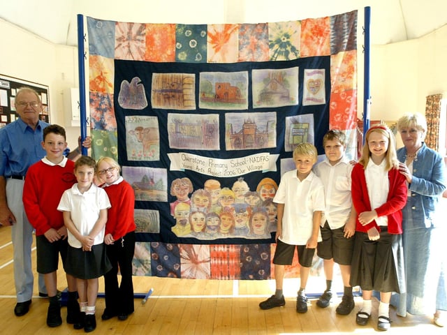 Overstone Primary School unveiling a collage based on the theme of the environment. Pictured: John Chapman, chairman of Northampton decorative and fine arts society, Oliver Steadman, 9, Ella Coulton, 8 Aimee Gilkes, 8, Alex Pattison, 10, Adam Barker, 9, Lauren Burgess, 9 and Kathy Stevens, textile artist. September 15, 2006