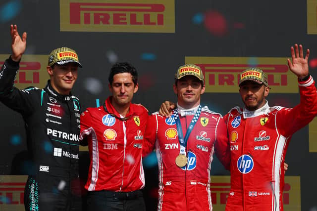 British pair George Russell and Lewis Hamilton joined winner Charles Leclerc on the Silverstone podium. (Photo by Clive Rose/Getty Images)