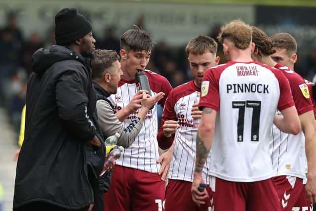 Jon Brady issues instructions to his players during Saturday's win.
