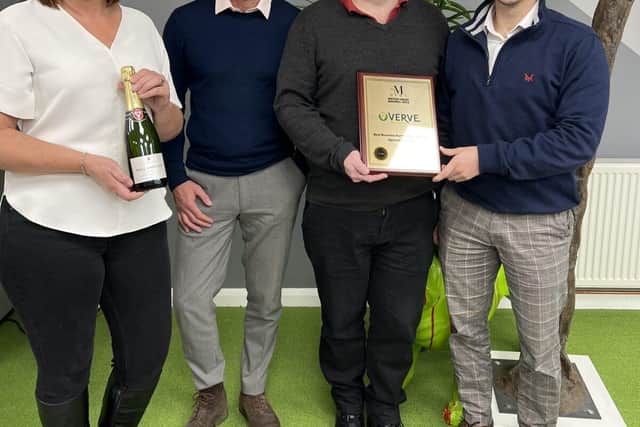 Verve Workspace team members with their award