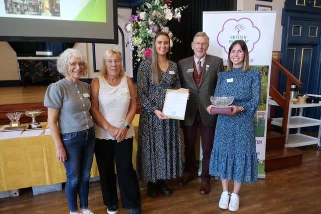 Members of the Northampton in Bloom Working Group receiving the Silver Gilt Award from RHS Judge John Constable