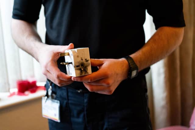 A firefighter delivering electrical safety advice during a home fire safety visit