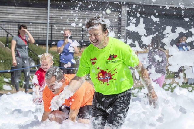 A family-friendly fun run, with water slides and obstacles, took place at Upton Country Park on Saturday (August 12) to raise funds for a Northampton charity.