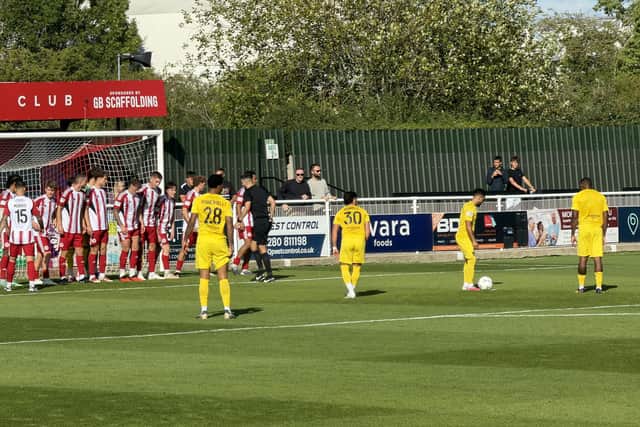 This picture tells a thousand words as Brackley Town were under the cosh for much of the game but held on to beat Harborough 1-0.