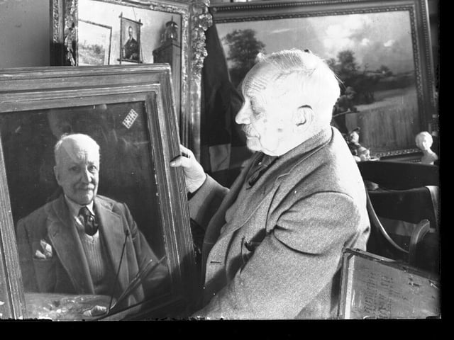 A man with portrait of himself