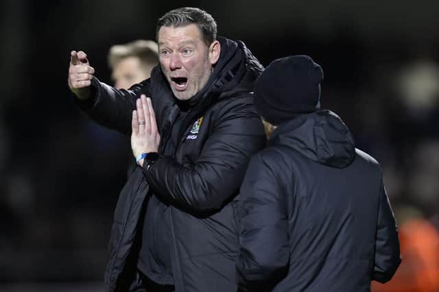 Cobblers boss Kevin Nolan shows his frustration during the 2-1 defeat to Barnsley on Tuesday (Picture: Pete Norton)