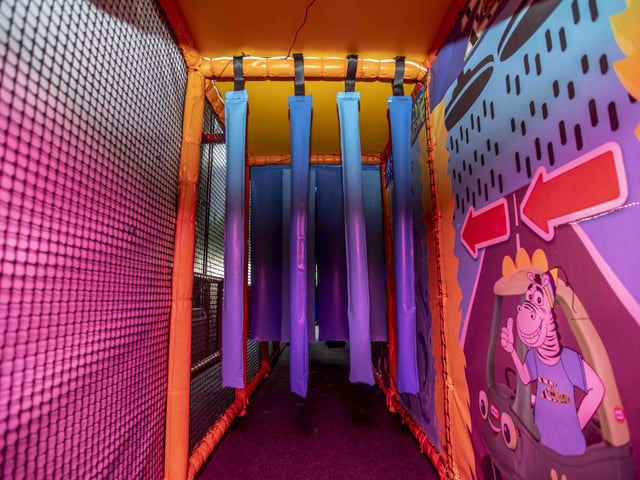 There is a new sensory room, car wash role play zone, two large ball pits with ball showers, and a sports court with astroturf on the top level.