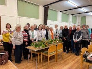 Wootton WI at AGM with floral decorations