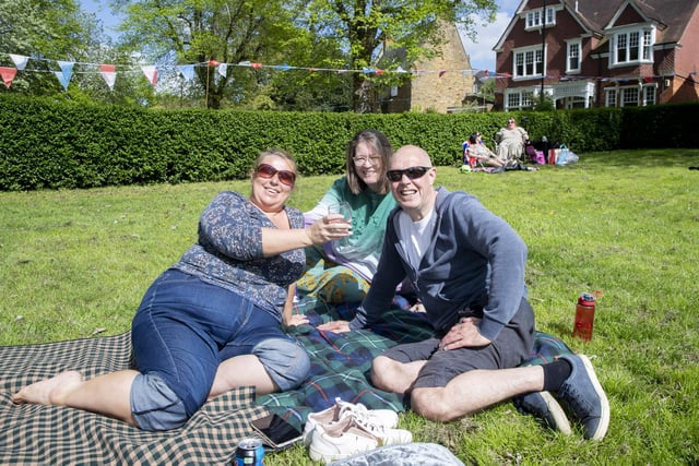 The residents of Kingsthorpe Village celebrate the coronation of King Charles III on their village green on Sunday, May 7, 2023.