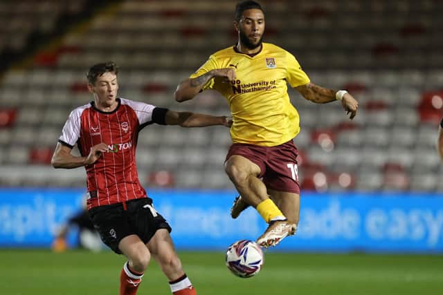 Tyler Roberts, who was later sent off for two bookings, in action at Lincoln City (Picture: Pete Norton)