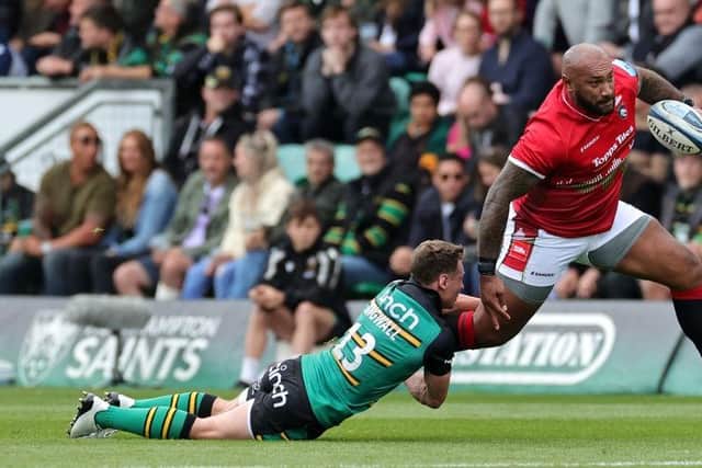 Leicester's Nemani Nadolo is held up by Fraser Dingwall