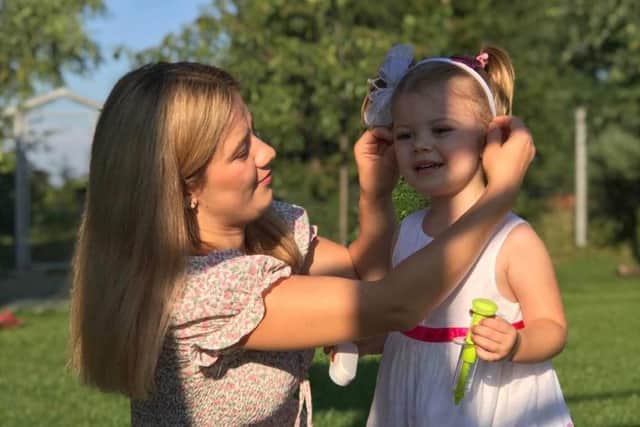 Mum Yulia and her daughter Varvara pictured in Poland, waiting to come to the UK.