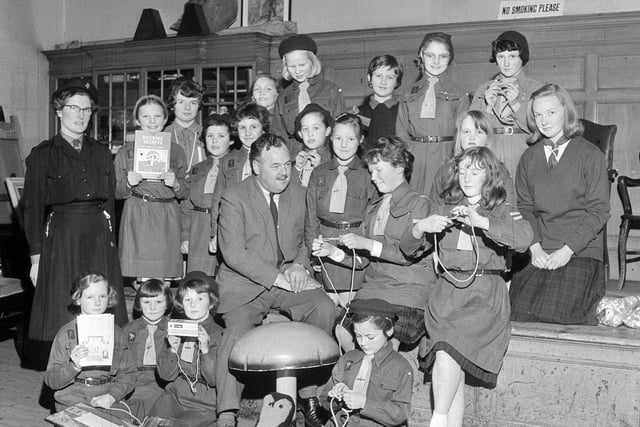Mr D MacKerracher visits the 73rd Brownie Pack in Corstorphine Old Parish Church Hall in January 1964.